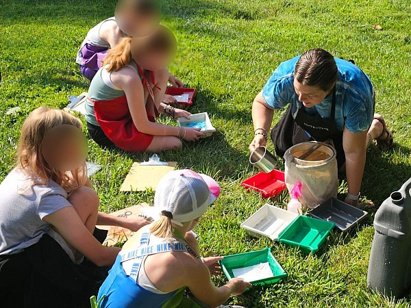 Christine helping kids rinse their photos at Carroll County Farm Museum's Living History Summer Camp.